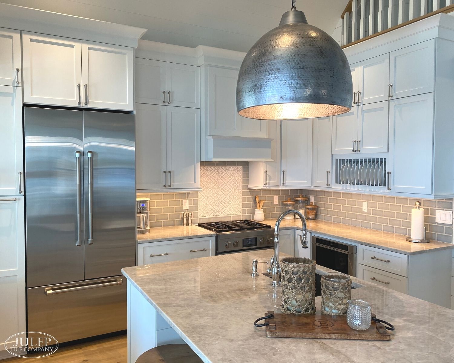Gorgeous two story kitchen, granite countertops, pendant lighting, blue  mosaic backsplash tile, g…